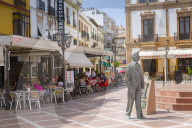 View of Statue and restaurants, Plaza del Socorro, Ronda, Andalusia, Spain, Europe