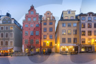View of colourful buildings on Stortorget, Old Town Square in Gamla Stan at dusk, Stockholm, Sweden, Scandinavia, Europe