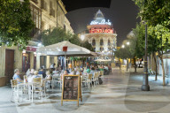 Night view of cafes along Calle Lanceria and El Gallo Azul rotunda building, Jerez de la Frontera, Andalucia, Spain, Europe