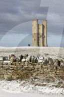 Broadway Tower and cotswold drystone wall in snow, Broadway, Cotswolds, Worcestershire, England, United Kingdom, Europe