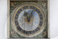 17th century clock with golden sun motif on facade of the Church of the Holy Ghost, Old Town, Tallinn, Estonia, Europe