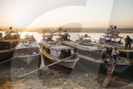 People unloading cargo from boats at Mayan Gyan Jetty, Ayeyarwady River, Mandalay, Mandalay Region, MyanmarMandalay, Mandalay Region, Myanmar