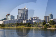 Austria, Vienna, Donau City reflecting in New Danube River
