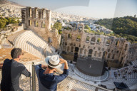 Tourists at Odeon of Herodes Atticus Theatre, by the Acropolis, Athens, Attica Region, Greece