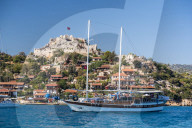 Simena Castle and Gulet sailing boat seen from Kekova Bay, Antalya Province, Lycia, Anatolia, Mediterranean Sea, Turkey