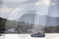 Gulat sailing boat with Taurus Mountains behind, Kemer, Antalya Province, Lycia, Anatolia, Mediterranean Sea, Turkey