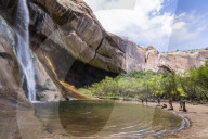 Hikers at Lower Calf Creek Falls, Grand Staircase-Escalante National Monument, Utah, USA.