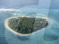 Aerial view of the heart-shaped island of Tavarua, near Viti Levu, Republic of Fiji.
