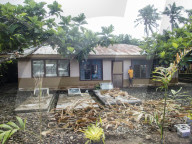 Ancestors graves in the front yard of a home in the town of Lufilufi on the island of Upolu, Samoa.