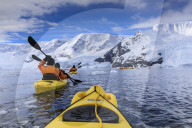 Kayaking amongst spectacular icebergs, mountains and glaciers, sunny Neko Harbour, Anvord Bay, Antarctic Peninsula, Antarctica