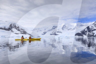Kayakers in spectacular mountain and glacial scenery, reflections of Neko Harbour, Anvord Bay, Antarctic Continent, Antarctica