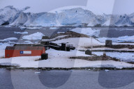 Elevated view, Chilean Gonzalez Videla Station, Gentoo penguins, icebergs and glacier, Waterboat Point, Paradise Bay, Antarctica