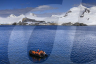 Zodiac boat, expedition tourists, landing beach, Half Moon Island, Livingston Island view, South Shetland Islands, Antarctica