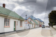 Traditional buildings with pastel iron roofs, Post Office, phone boxes, taxi, Central Stanley, Port Stanley, Falkland Islands