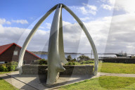 Restored Whalebone Arch, ships and the Narrows waterfront, Stanley Harbour, Port Stanley, Falkland Islands