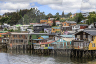 Palafitos, colourful stilt houses on water's edge, unique to Chiloe, Castro, Isla Grande de Chiloe, Chile