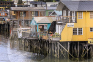 Palafitos, colourful stilt houses on water's edge, unique to Chiloe, Castro, Isla Grande de Chiloe, Chile