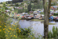 Palafitos, colourful stilt houses on water's edge, elevated view, unique to Chiloe, Castro, Isla Grande de Chiloe, Chile
