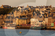 Lerwick, capital, from the sea, waterfront sandstone buildings, golden early morning, Shetland Islands, Scotland, United Kingdom