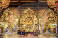 Ninh Binh, Gia Sinh, buddhas inside a pagoda at Bai Dinh Mahayana Buddhist Temple near Tam Coc