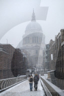 London in the snow - view of St. Paul's cathedral and the Millennium Bridge