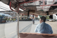 Tuk tuk driver in the streets of Kampt Town