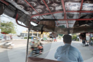 Tuk tuk driver in the streets of Kampt Town