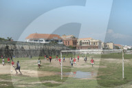 Children playing football outside the Spanish colonial city walls of Cartagena in the Colombian Caribbean