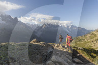 Hikers on footpath leading to Lacs De Cheserys from Argentiere, Haute Savoie, France