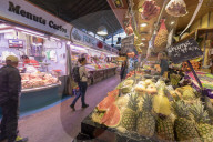 Stalls of food in the indoor La Boqueria Market, Ciudad Vieja, Barcelona, Catalonia, Spain