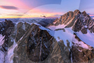 Aerial view of helicopter in flight towards Piz Roseg at sunset, Bernina Group, border of Italy and Switzerland