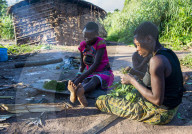 Baka pygmies preparing food in the Unesco world heritage sight Dzanga-Sangha Special Reserve, Central African Republic