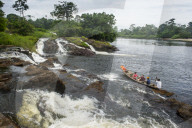 Tourist boat below the Lobe waterfalls, Kribi, Cameroon