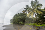 Black volcanic sand on six mile beach near Limbe, southern Cameroon