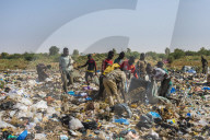 Local boys looking for valuables in the public dump, Niamey, Niger