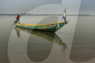 Man on his little boat before the former sklave colony Bunce island, Sierra Leone