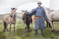 Mongol Horseman at Mandal Mountain. Mongolia.