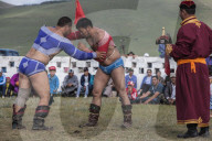 The wrestling match is one of the main attractions of Naadam Festival. Only men participate in wrestling match.