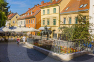 Couple walking past Saint George slains The Dragon monument, Zagreb, Croatia, Europe