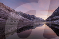 Loch Achtriochtan in winter with snow-capped mountains and reflections, Glencoe, Highlands, Scotland, United Kingdom, Europe