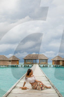Relaxing at the Conrad Maldives over water yoga studio.