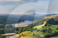 Peak District, Upper Derwent Valley with two Lancaster bombers passing the Derwent Dam in the style of 617 Squadron Dambusters