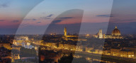 Panorama of the Florence skyline at dusk with the Palazzo Vecchio, Duomo and Campanile extending above the horizon