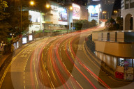 Car light trails on a busy road in Central, Hong Kong Island by night, Hong Kong