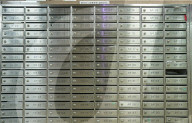 Post boxes in the foyer of an apartment building, Hong Kong