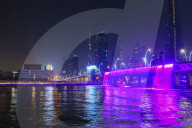 Dubai Water Canal Waterfall Bridge, the waterfall parts to allow boats to pass under. Dubai, United Arab Emirates