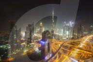 Dubai skyline and Sheikh Zayed Road Interchange by night, Dubai, United Arab Emirates