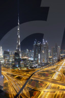 Dubai skyline and Sheikh Zayed Road Interchange by night, Dubai, United Arab Emirates
