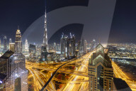 Dubai skyline and Sheikh Zayed Road Interchange by night, Dubai, United Arab Emirates