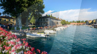 Floral display at entrance to Peschiera del Garda in Veneto, Italy on a summer day